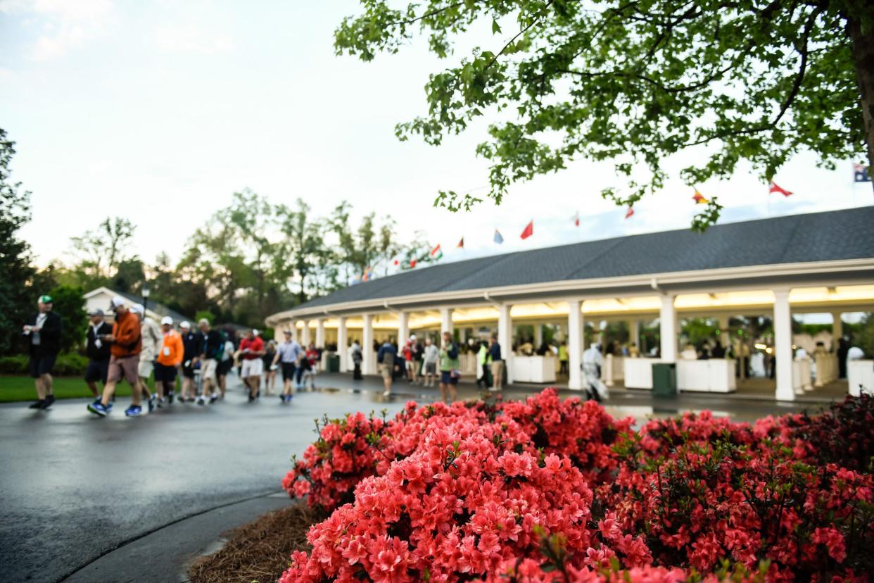 Patrons enter the gates during a practice round of the 2018 Masters Tournament at Augusta National Golf Club.