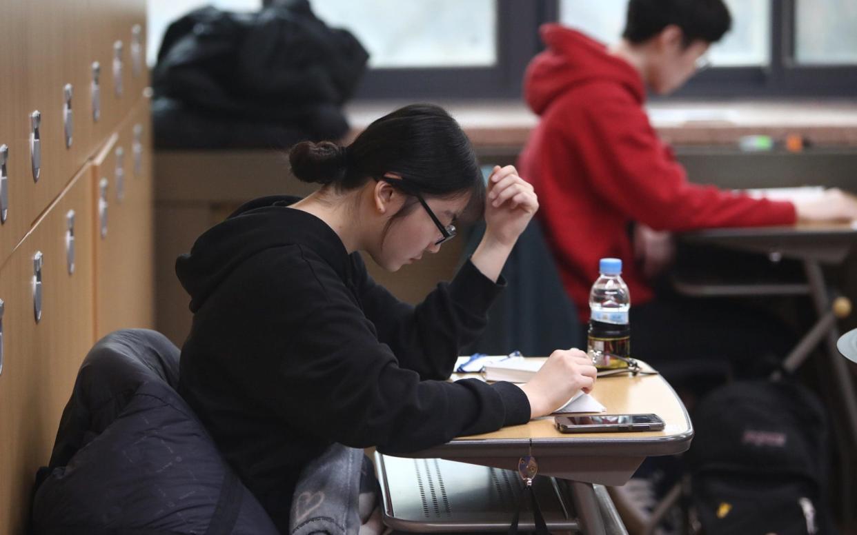 Bullying in South Korean schools is believed to be fuelled by the extreme pressure faced by students - Getty Images AsiaPac