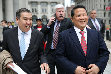 Macau billionaire real estate developer Ng Lap Seng (R), accused of bribing former United Nations General Assembly president John Ashe, exits the Manhattan U.S. District Courthouse in New York, U.S. April 7, 2017. REUTERS/Ashlee Espinal