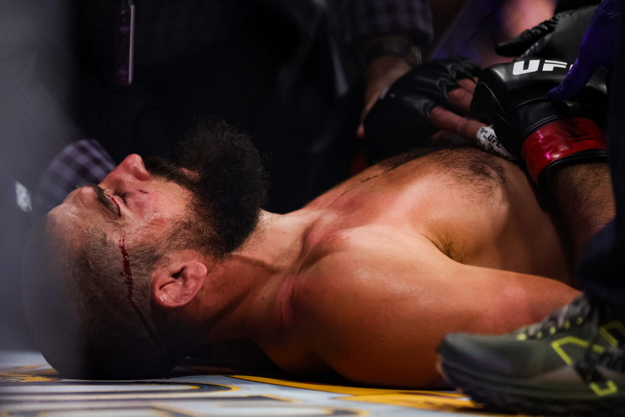 AUSTIN, TEXAS - JUNE 18: Court McGee is tended to by staff after being knocked out by Jeremiah Wells in their welterweight fight at the UFC Fight Night event at Moody Center on June 18, 2022 in Austin, Texas. (Photo by Carmen Mandato/Getty Images)