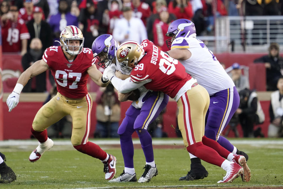 San Francisco 49ers defensive tackle DeForest Buckner (99) sacks Minnesota Vikings quarterback Kirk Cousins as 49ers defensive end Nick Bosa (97), left, moves in during the second half of an NFL divisional playoff football game, Saturday, Jan. 11, 2020, in Santa Clara, Calif. (AP Photo/Tony Avelar)