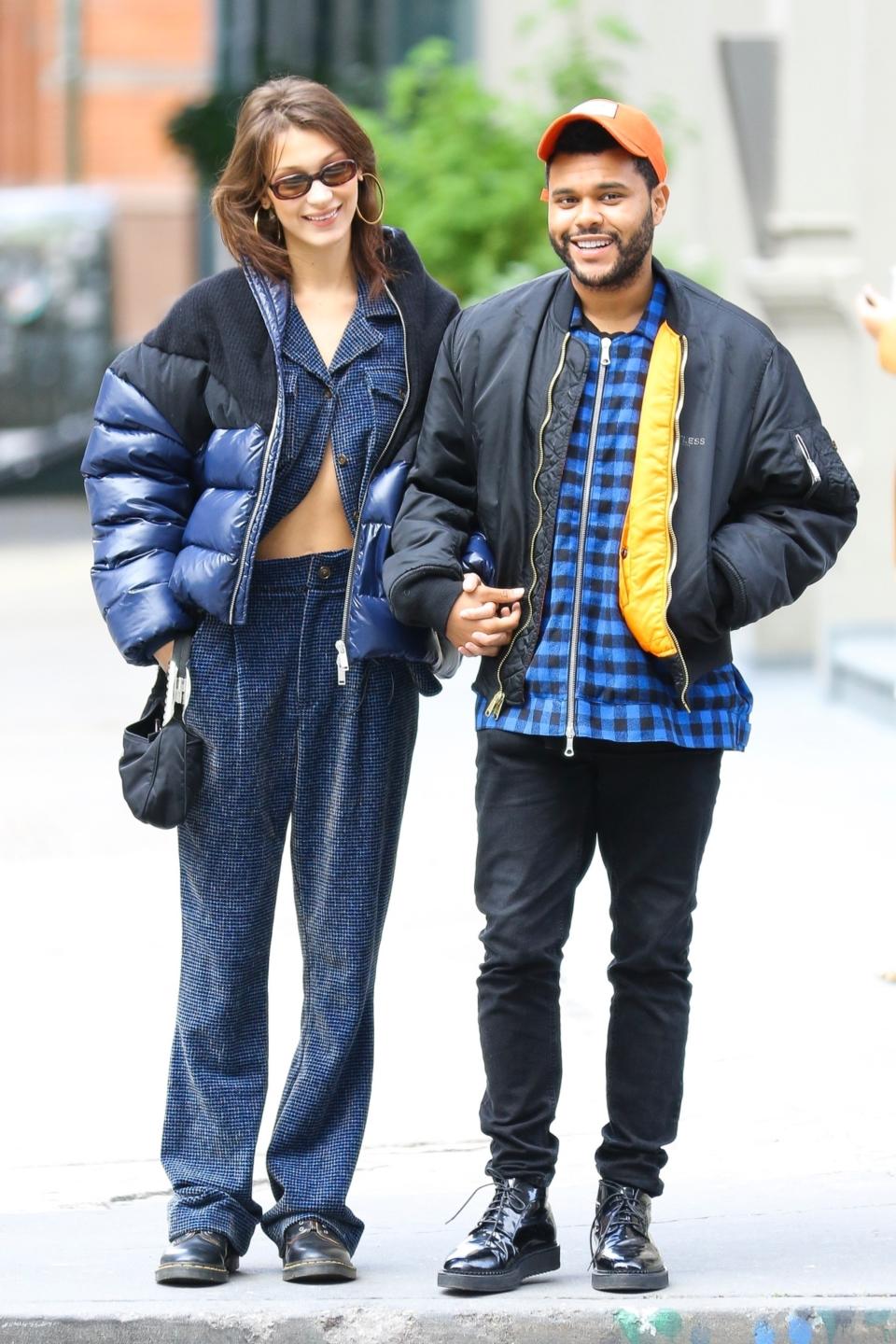 New York, NY  - On-again couple Bella Hadid and The Weeknd are all smiles as they hold hands while on a stroll in New York. The pair, who are now living together, seem to be stronger than ever as they reportedly consider themselves "unofficially engaged."Pictured: Bella Hadid, The WeekndBACKGRID USA 29 OCTOBER 2018 USA: +1 310 798 9111 / usasales@backgrid.comUK: +44 208 344 2007 / uksales@backgrid.comUK Clients - Pictures Containing ChildrenPlease Pixelate Face Prior To Publication