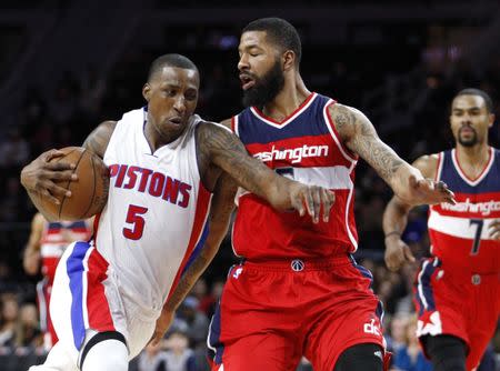 FILE PHOTO: Apr 8, 2016; Auburn Hills, MI, USA; Detroit Pistons guard Kentavious Caldwell-Pope (5) drives to the basket against Washington Wizards forward Markieff Morris (5) during the third quarter at The Palace of Auburn Hills. Pistons win 112-99. Mandatory Credit: Raj Mehta-USA TODAY Sports / Reuters (TAGS: Sport Basketball NBA) *** Local Caption *** 2016-04-09T025635Z_1295232958_NOCID_RTRMADP_3_NBA-WASHINGTON-WIZARDS-AT-DETROIT-PISTONS.JPG