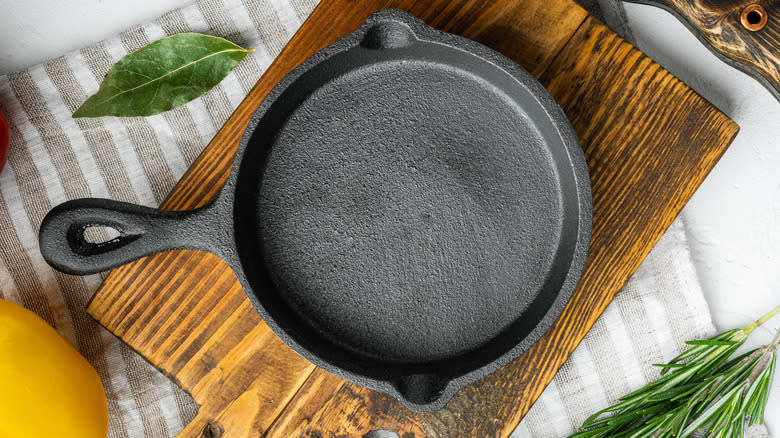 cast iron pan on board