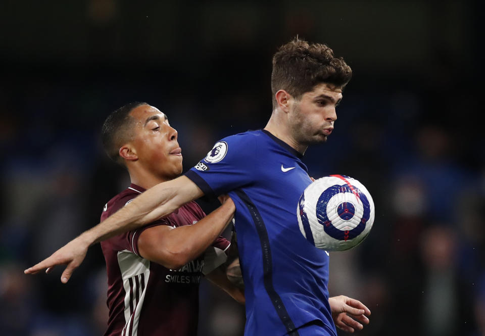 Leicester's Youri Tielemans, left, duels for the ball with Chelsea's Christian Pulisic during the English Premier League soccer match between Chelsea and Leicester City at Stamford Bridge Stadium in London, Tuesday, May 18, 2021. (Peter Cziiborra/Pool via AP)