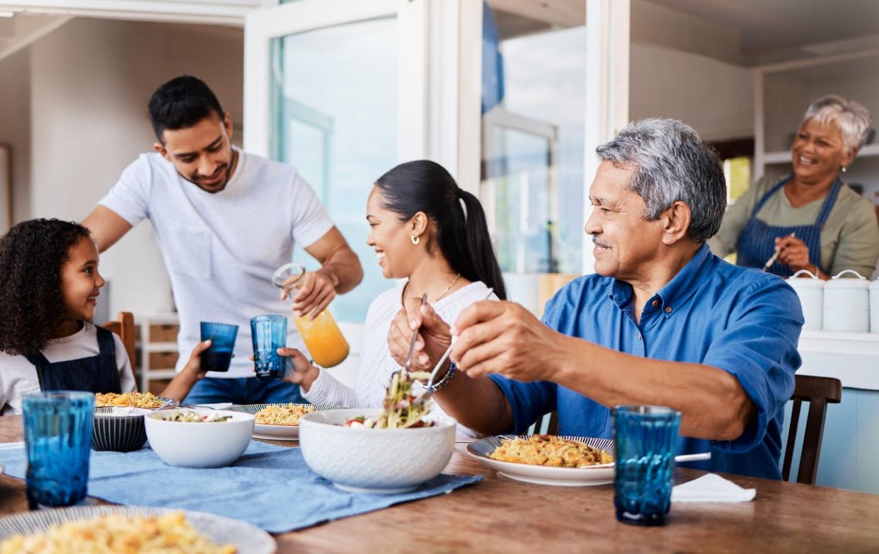 Shot of a happy family having lunch together at home