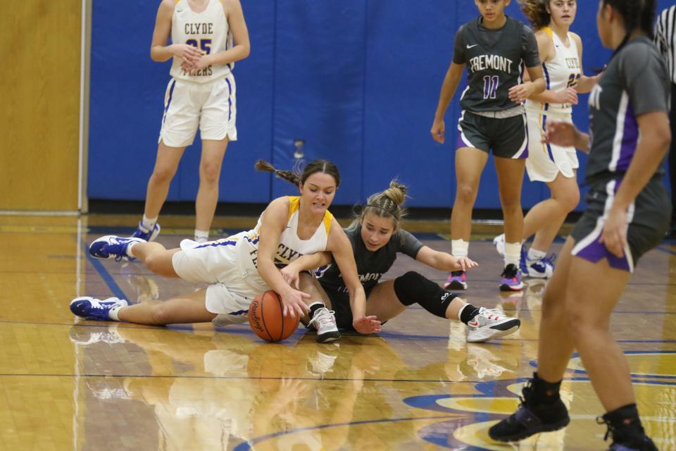 Clyde's Lexi Carlson and Ross' Natalia Alejandro fight for a loose ball.