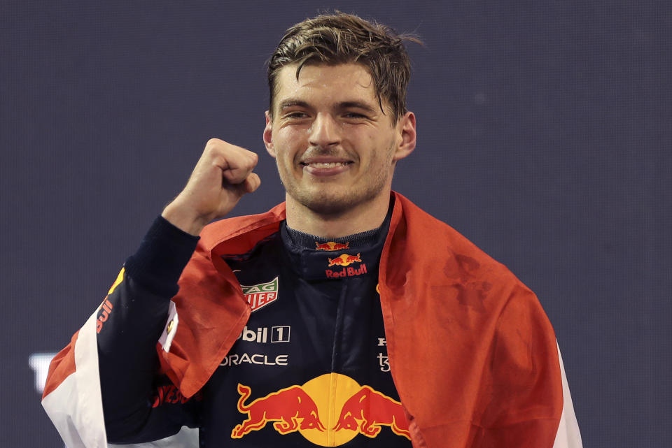 Red Bull driver Max Verstappen of the Netherlands celebrates after becoming F1 drivers world champion after winning the Formula One Abu Dhabi Grand Prix in Abu Dhabi, United Arab Emirates, Sunday, Dec. 12. 2021. (AP Photo/Kamran Jebreili, Pool)