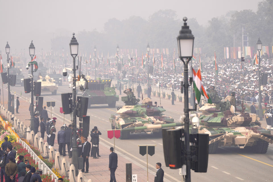 Indian defense forces march through the ceremonial Kartavya Path boulevard during India's Republic Day parade celebrations in New Delhi, India, Friday, Jan. 26, 2024. Thousands of people cheer a colorful parade showcasing India's defense capability and cultural heritage braving a winter chill and mist on a ceremonial boulevard in the Indian capital. (AP Photo/Manish Swarup)