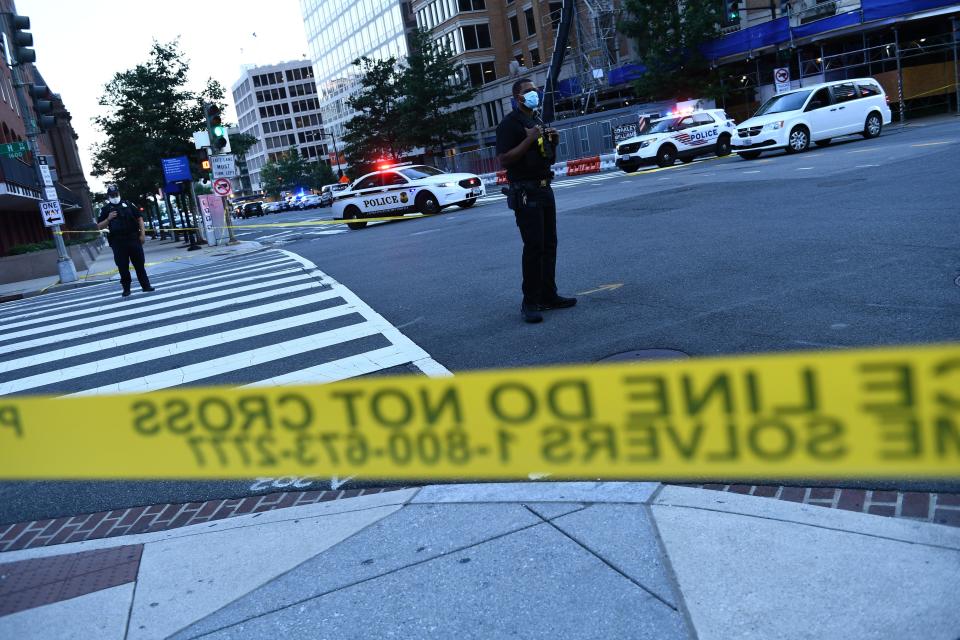 Police activity at the entrance to Pennsylvania Avenue near the White House shortly after Secret Service guards shot a person who was apparently armed, outside the White House on August 10, 2020 while US President Donald Trump was speaking to the press in the Brady Briefing Room of the White House in Washington, DC. - Secret Service guards shot a person, who was apparently armed, outside the White House on August 10, 2020. President Donald Trump said just after being briefly evacuated in the middle of a press conference. (Photo by Brendan Smialowski / AFP) (Photo by BRENDAN SMIALOWSKI/AFP via Getty Images)