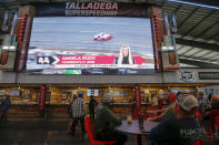 Fans explore the new facilities and garages at Talladega Superspeedway, Saturday, Oct. 12, 2019, in Talladega, Ala. (AP Photo/Butch Dill)