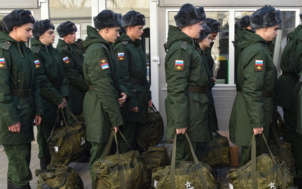 Russian conscripts line up in military uniform as they prepare to leave for Crimea - EPA-EFE/Shutterstock