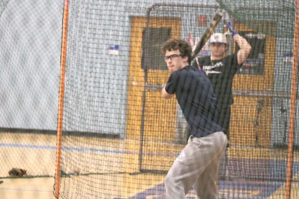 Oyster River sophomore catcher Collin Klein gets in some swings during Thursday's practice.