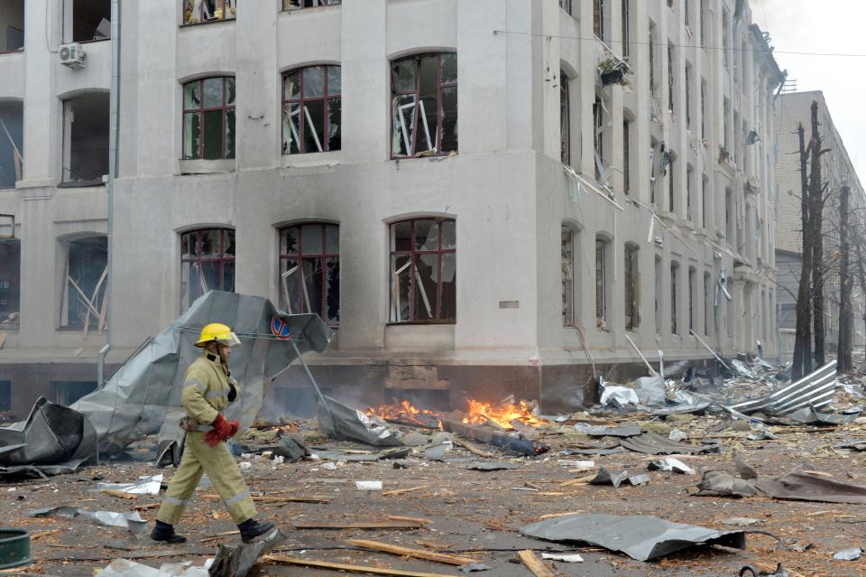 Firefighters work to contain a fire at the Economy Department building of Karazin Kharkiv National University, allegedly hit during recent shelling by Russia, in Kharkiv on March 2, 2022. (Photo by Sergey BOBOK / AFP) (Photo by SERGEY BOBOK/AFP via Getty Images)