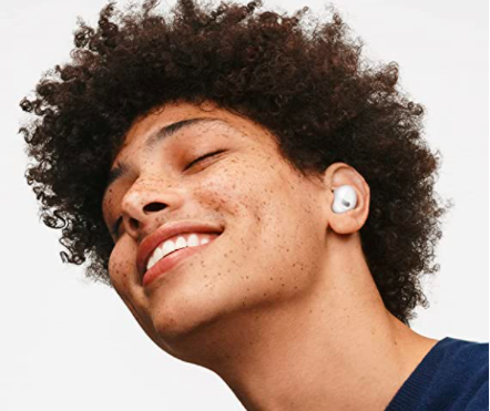 Person wearing white earbuds