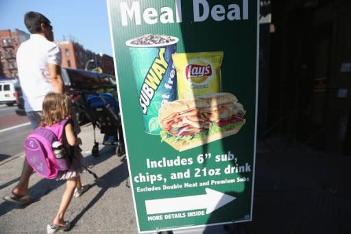 File picture shows an advertisement features 21 ounce drinks in New York City. New York became the first city in the United States to impose a limited ban on super-sized soda drinks blamed by Mayor Michael Bloomberg for fueling a national obesity crisis