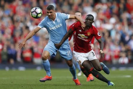 Britain Soccer Football - Manchester United v Stoke City - Premier League - Old Trafford - 2/10/16 Stoke City's Jonathan Walters in action with Manchester United's Eric Bailly Reuters / Russell Cheyne Livepic