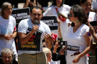 <p>An undocumented immigrant from El Salvador who gave his name as Mario weeps as he tells the story of his daughter and wife being separated and detained at the border as they attempted to join him in the U.S. to demonstrators during a rally and march calling for “an end to family detention” and in opposition to the immigration policies of the Trump administration in Washington, D.C., June 28, 2018. (Photo: Jonathan Ernst/Reuters) </p>