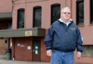 Unemployed autoworker Donald Coy, who was laid off from Ross's auto-parts plant, when it closed its doors in December 2016, is pictured in front of the former manufacturing plant in Canton, Ohio, U.S., January 14, 2017. REUTERS/Aaron Josefczyk