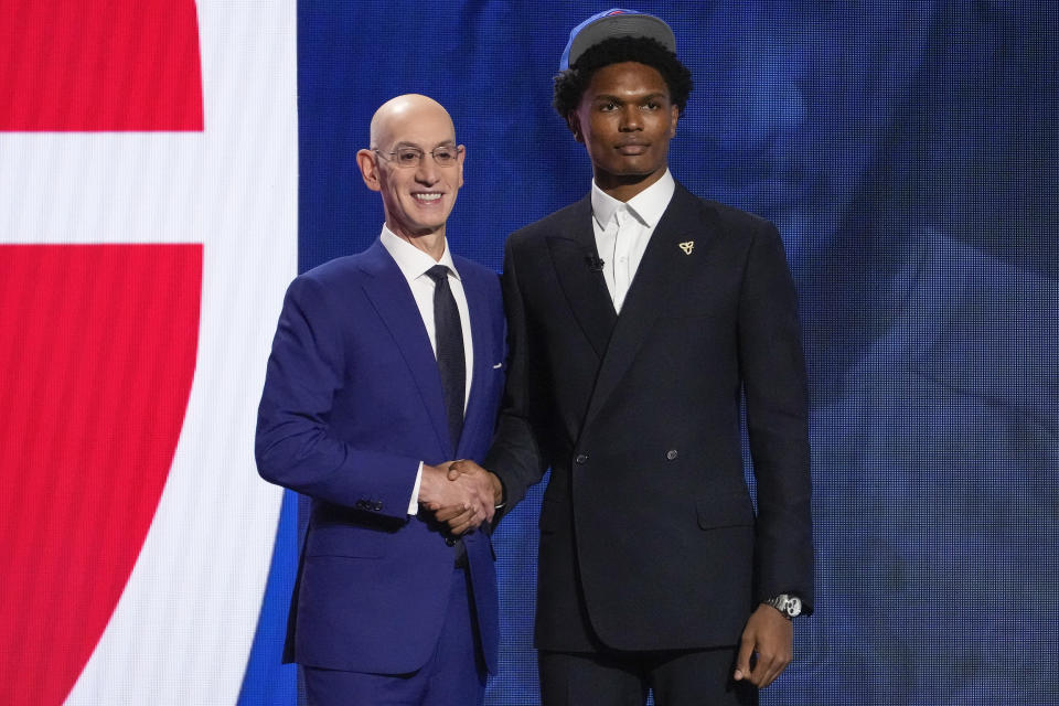 Ausar Thompson poses for a photo with NBA Commissioner Adam Silver after being selected fifth overall by the Detroit Pistons during the NBA basketball draft, Thursday, June 22, 2023, in New York. (AP Photo/John Minchillo)