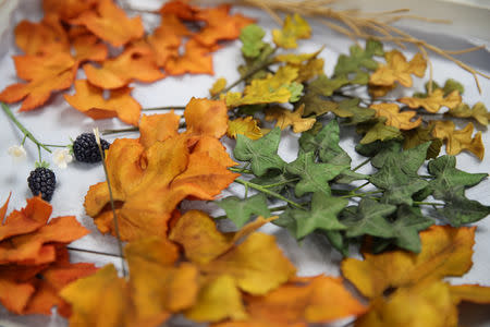 Leaf cake decorations can be seen in the kitchen before they are added to the red velvet and chocolate wedding cake for the marriage at Windsor Castle of Britain's Princess Eugenie and Jack Brooksbank, at Buckingham Palace in London, Britain, October 10, 2018. Chris Jackson/Pool via REUTERS