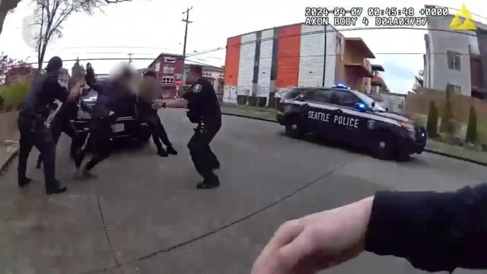 As officers tried to place the suspect in handcuffs, the boy attempted to run away. Seattle Police Department