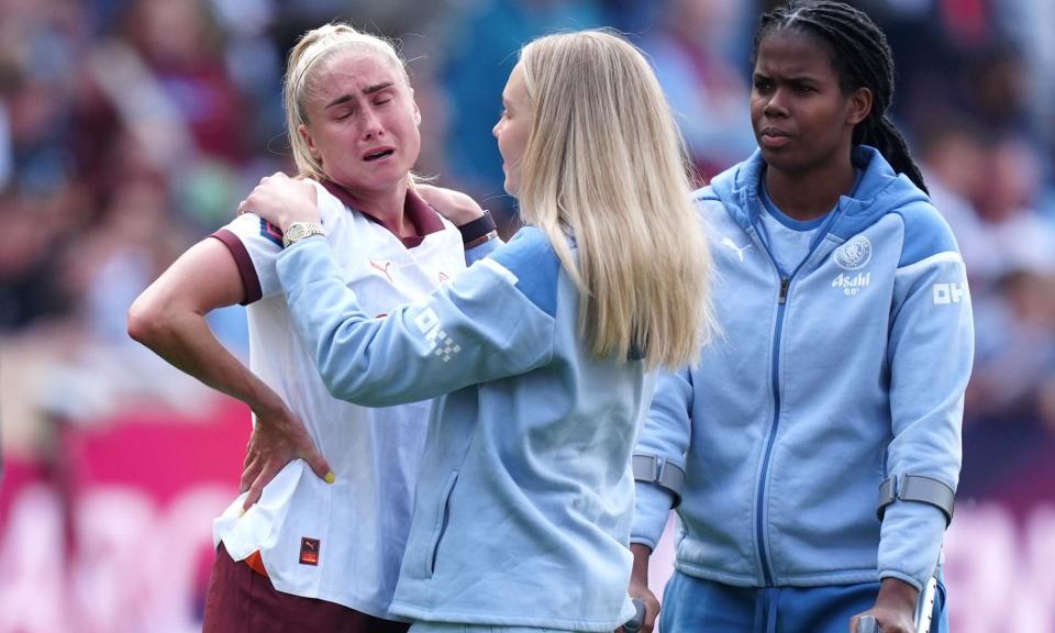 <span>Manchester City's Steph Houghton (left) in despair after the final whistle.</span><span>Photograph: Mike Egerton/PA</span>