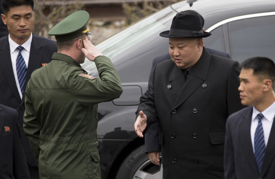 North Korean leader Kim Jong Un, second right, arrives for a wreath laying ceremony in Vladivostok, Russia, Friday, April 26, 2019. Kim paid his respects at a ceremony honoring the war dead Friday to wrap up a brief and generally successful visit to the Russian Far East for his first summit with President Vladimir Putin. (AP Photo/Alexander Khitrov)