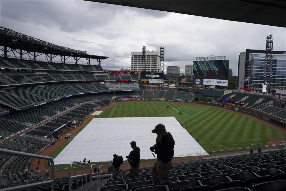 Hank Aaron's No. 44 is etched on the outfield grass at Truist Park before Game 3 of baseball's World Series between the Houston Astros and the Atlanta Braves Friday, Oct. 29, 2021, in Atlanta. The legacy of the late Braves Hall of Famer is stamped all over this matchup between Atlanta and the Houston Astros. (AP Photo/Brynn Anderson)