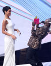 Kevin Hart, right, presents the award for video of the year to Rihanna for "We Found Love" at the MTV Video Music Awards on Thursday, Sept. 6, 2012, in Los Angeles. (Photo by Matt Sayles/Invision/AP)