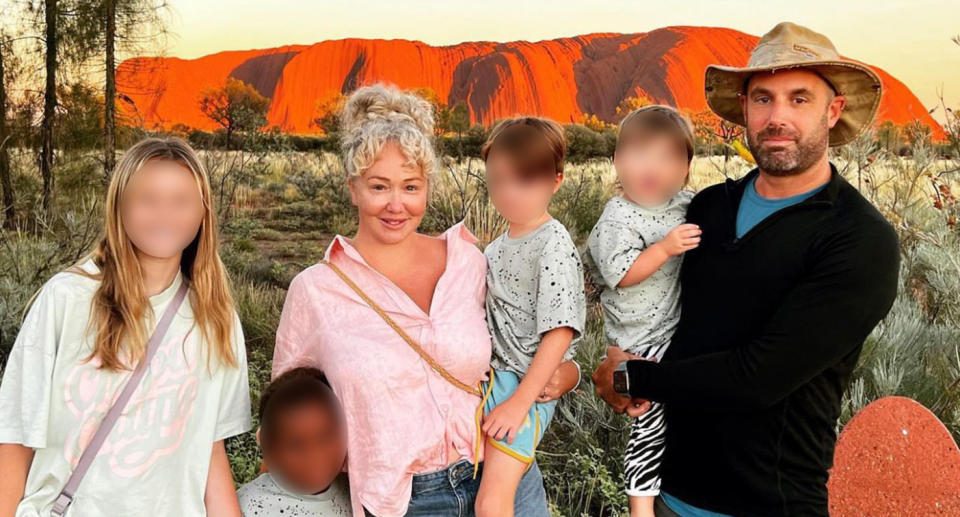 Family including adopted children at Uluru