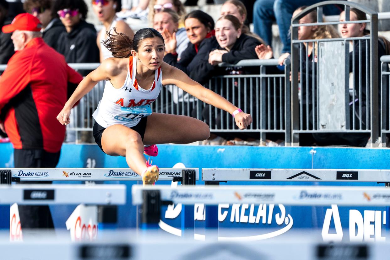 Ames' Angelica Attinger competes in the 100 meter shuttle hurdle relay preliminary races during the Drake Relays at Drake Stadium on Saturday, April 27, 2024, in Des Moines.