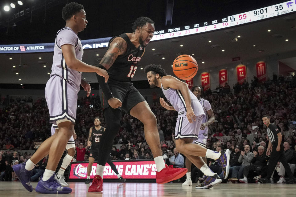 Houston forward J'Wan Roberts (13) celebrates after he scored during the second half of an NCAA college basketball game against Kansas State, Saturday, Jan. 27, 2024, in Houston. (Jon Shapley/Houston Chronicle via AP)