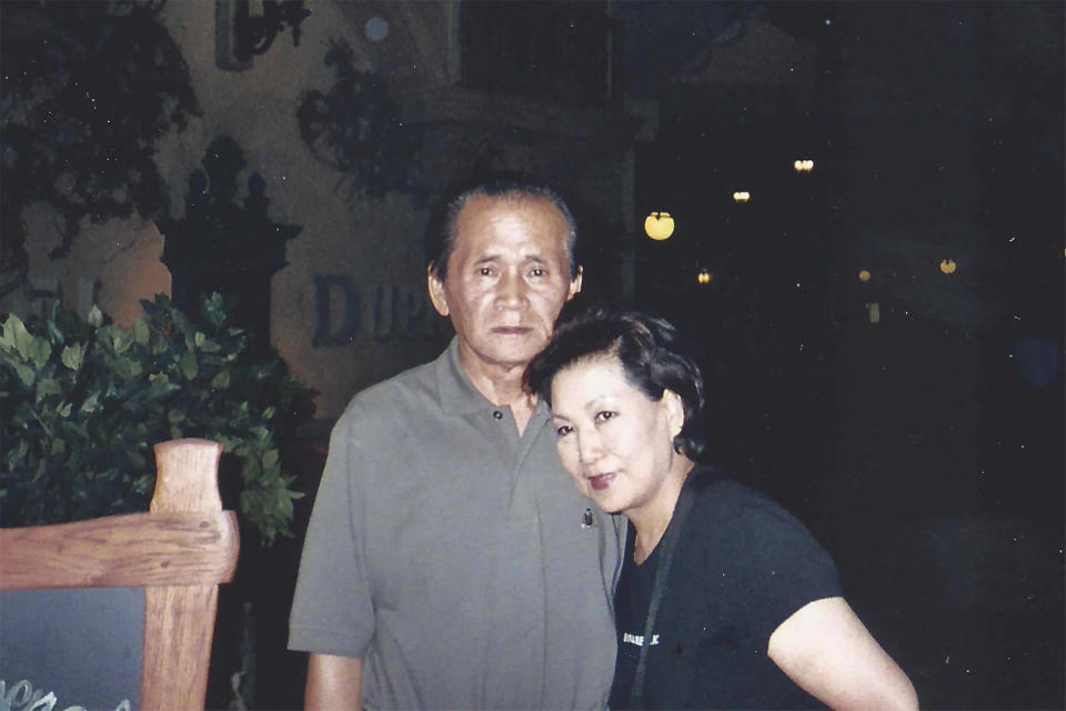 In this family photo provided by Charlton Rhee, his parents, Man Joon Rhee and Eulja Rhee pose for a photo in Las Vegas in 2012. Charlton Rhee, whose parents came to the U.S. from South Korea, lost both of them to COVID-19 as the virus surged in New York City. A joint analysis by The Associated Press and The Marshall Project found that Asian Americans join Black and Hispanic Americans among the hardest-hit groups, with deaths in each group up at least 30% this year. (Courtesy of Charlton Rhee via AP)