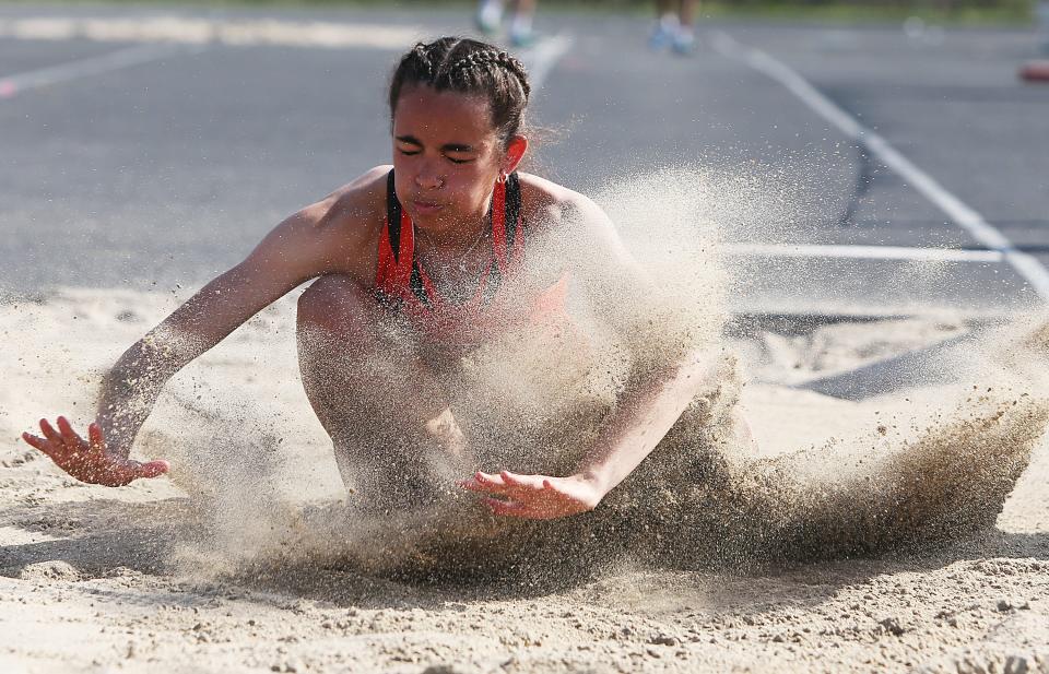 Sophomore Sophia Hatcher gives the Ames girls track and field team a versatile athlete who can score points in sprint and hurdle races along with the long jump.