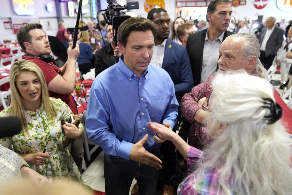 Florida Gov. Ron DeSantis greets audience members during a fundraising picnic for U.S. Rep. Randy Feenstra, R-Iowa, Saturday, May 13, 2023, in Sioux Center, Iowa. (AP Photo/Charlie Neibergall)