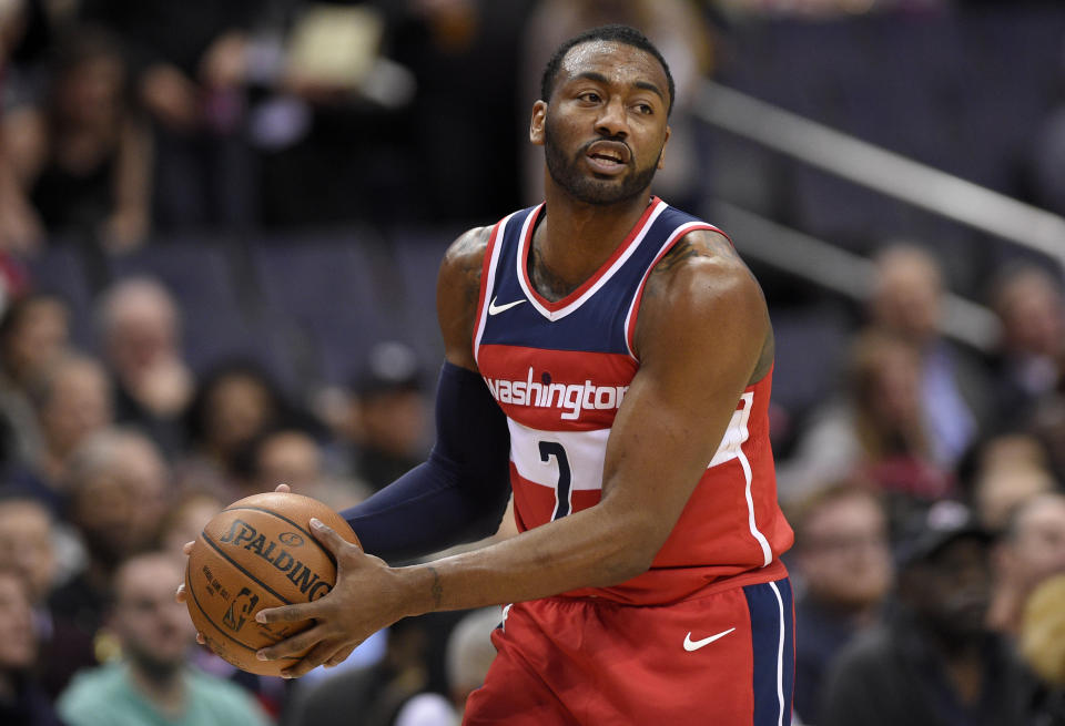 John Wall is one of the GOATs of Christmas gift-giving.(AP Photo/Nick Wass)
