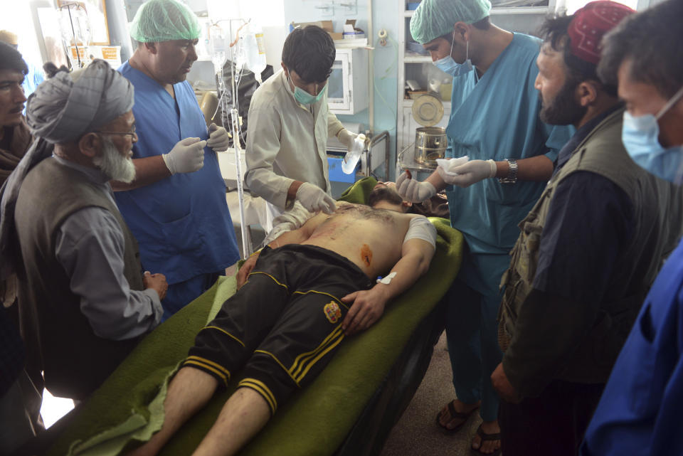 In this Sunday, Aug. 12, 2018, photo, an Injured man receives treatment at a hospital in Ghazni province, west of Kabul, Afghanistan. The United States has sent military advisers to aid Afghan forces in Ghazni, where they were struggling on Sunday to regain full control three days after the Taliban launched a massive assault on the eastern city. (AP Photo/Mohammad Anwar Danishyar)