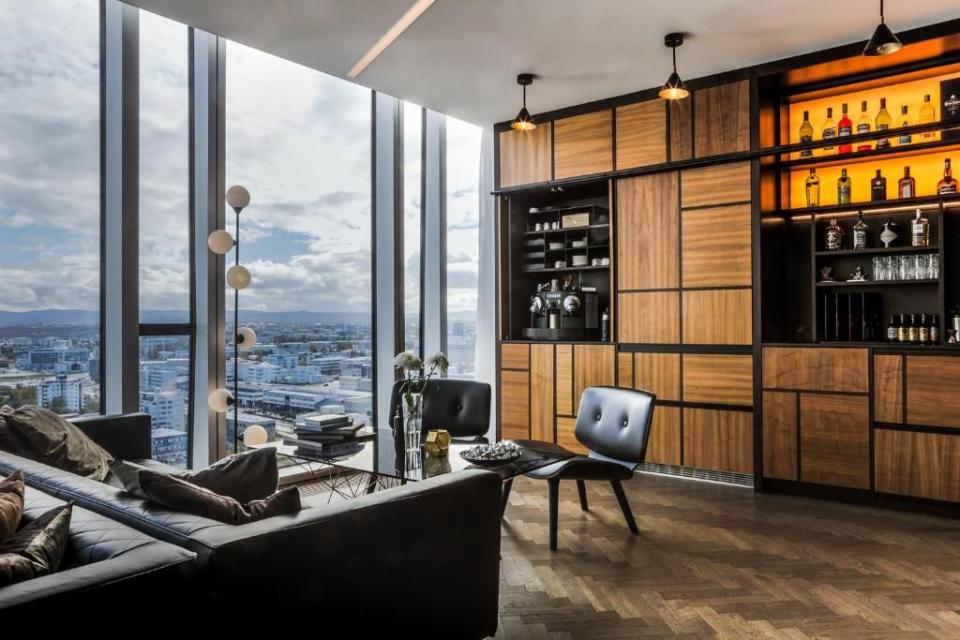 <p>All of Reykjavik and the surrounding coastline, mountains and glaciers lie at your feet at this eight-suite eyrie on the 20th floor of the city’s tallest building, <a href="https://www.booking.com/hotel/is/tower-suites-reykjavik.en-gb.html?aid=2070935&label=iceland-hotels" rel="nofollow noopener" target="_blank" data-ylk="slk:Tower Suites;elm:context_link;itc:0;sec:content-canvas" class="link ">Tower Suites</a>. When you’re not tracking the changing weather and light patterns courtesy of your in-suite telescope, you’re a short stroll from landmarks including Hofdi lighthouse and Klambratun Park with its art gallery and zip-wire. </p><p>Some of the sleek modern suites come with eggshell baths set in front of floor-to-ceiling windows. Invisible check-in via smartphone is available for those who like to keep things discreet, but champagne on arrival, a full concierge service and the Skylounge with an honesty bar bring a human touch to proceedings.</p><p><a class="link " href="https://www.booking.com/hotel/is/tower-suites-reykjavik.en-gb.html?aid=2070935&label=iceland-hotels" rel="nofollow noopener" target="_blank" data-ylk="slk:CHECK AVAILABILITY;elm:context_link;itc:0;sec:content-canvas">CHECK AVAILABILITY</a></p>