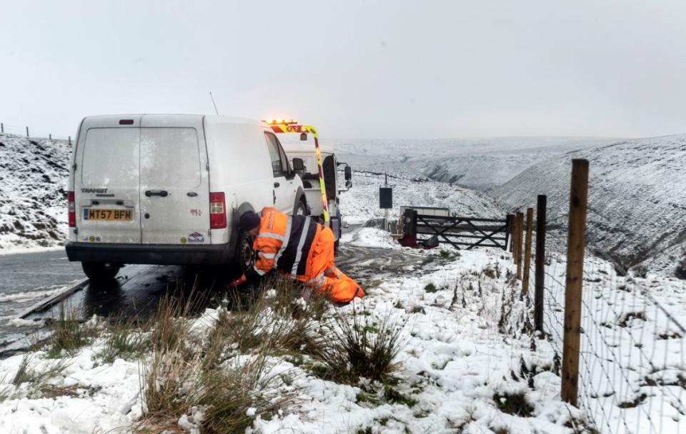 A crashed car is recovered on Derbyshire’s Snake Pass on Wednesday (PA)