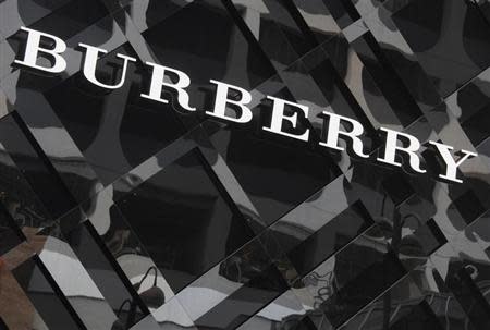 A logo of Burberry is displayed outside its store at Tsim Sha Tsui shopping district in Hong Kong January 18, 2013. REUTERS/Bobby Yip