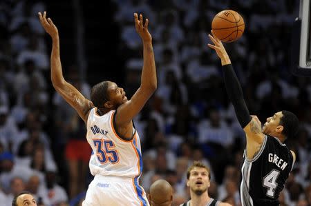 May 31, 2014; Oklahoma City, OK, USA; Oklahoma City Thunder forward Kevin Durant (35) loses the ball during a shot attempt against San Antonio Spurs guard Danny Green (4) during the fourth quarter in game six of the Western Conference Finals of the 2014 NBA Playoffs at Chesapeake Energy Arena. Mandatory Credit: Mark D. Smith-USA TODAY Sports