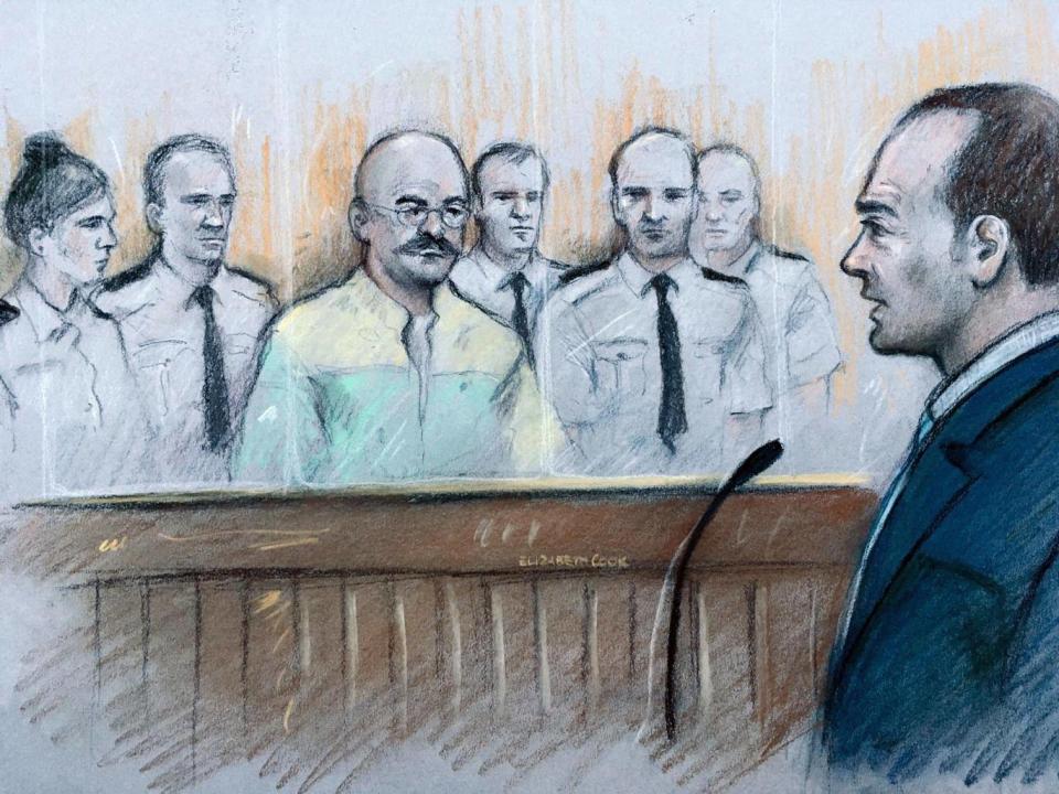 A court artist sketch of Charles Bronson listening as prison governor Mark Docherty gives evidence at Leeds Crown Court (PA/Elizabeth Cook)