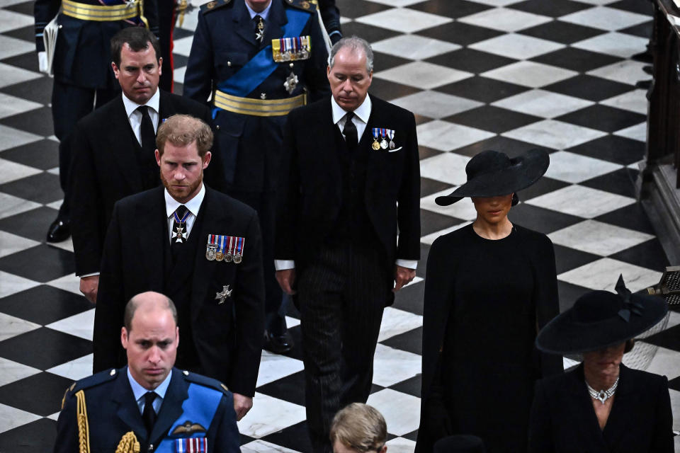 Peter Phillips (L), Britain's Prince Harry, Duke of Sussex (centre left), Britain's Prince William, Prince of Wales (bottom left), Britain's Earl of Snowdon (C) and Britain's Meghan, Duchess of Sussex (R) leave the Abbey at the State Funeral Service for Britain's Queen Elizabeth II, at Westminster Abbey in London on September 19, 2022.<span class="copyright">Ben Stansall—Pool/AFP/Getty Images</span>