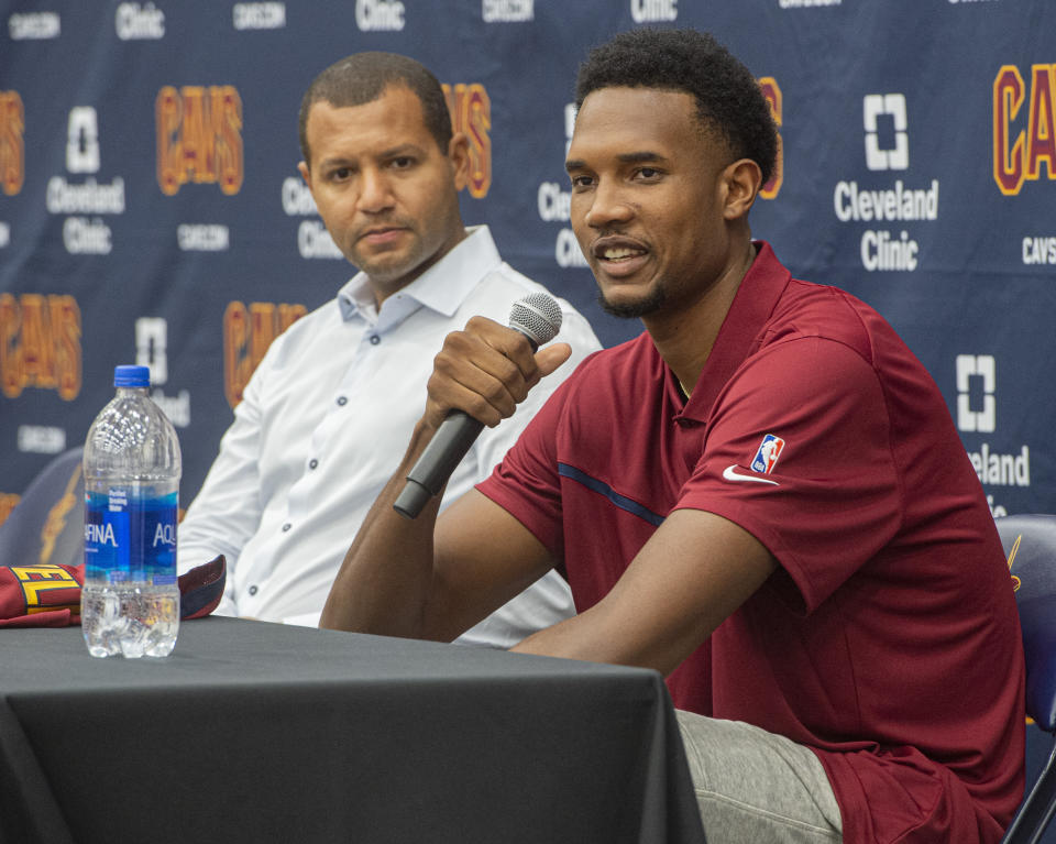 Cleveland Cavaliers first-round draft selection Evan Mobley, right, speaks with reporters as Cavaliers GM Koby Altman listens during a news conference at the NBA basketball team's training facility in Independence, Ohio, Friday, July 30, 2021. (AP Photo/Phil Long)