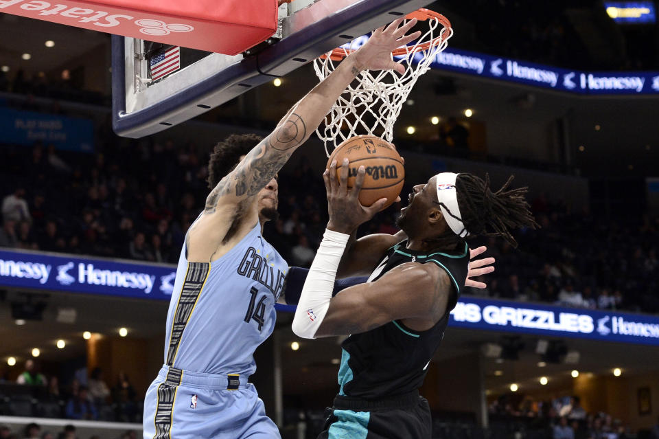 Portland Trail Blazers forward Jerami Grant (9) shoots against Memphis Grizzlies guard Danny Green (14) in the first half of an NBA basketball game Wednesday, Feb. 1, 2023, in Memphis, Tenn. (AP Photo/Brandon Dill)