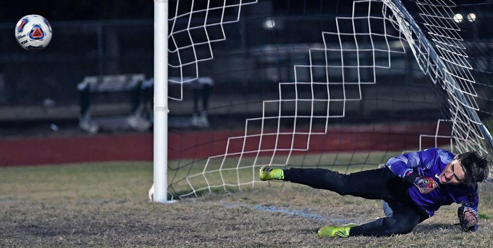 Lakewood Ranch High goaltender Joah McManis makes a key save on Orlando Olympia's second penalty kick to give the Mustangs a win in their Class 7A-Region 2 quarterfinal match.