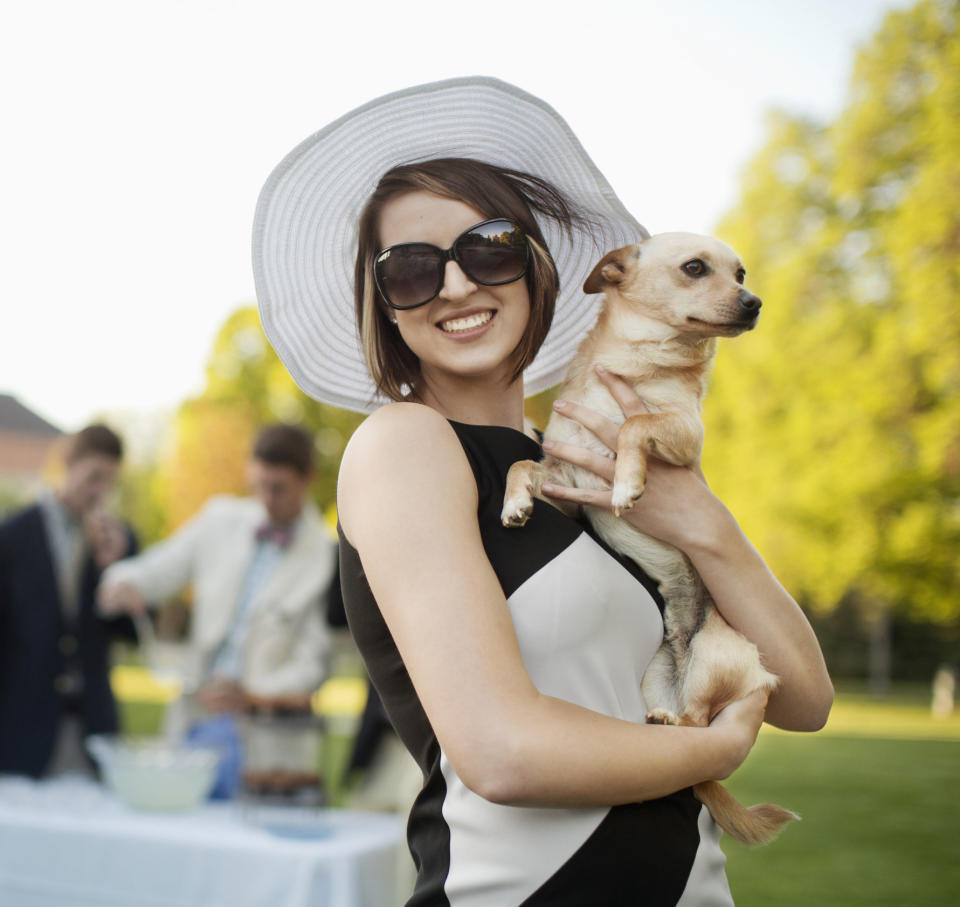 A woman holding a dog