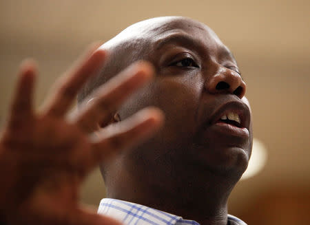 U.S. Senator Tim Scott (R-SC) answers a question at a town hall meeting for constituents in North Charleston, South Carolina, U.S. February 25, 2017. REUTERS/Randall Hill