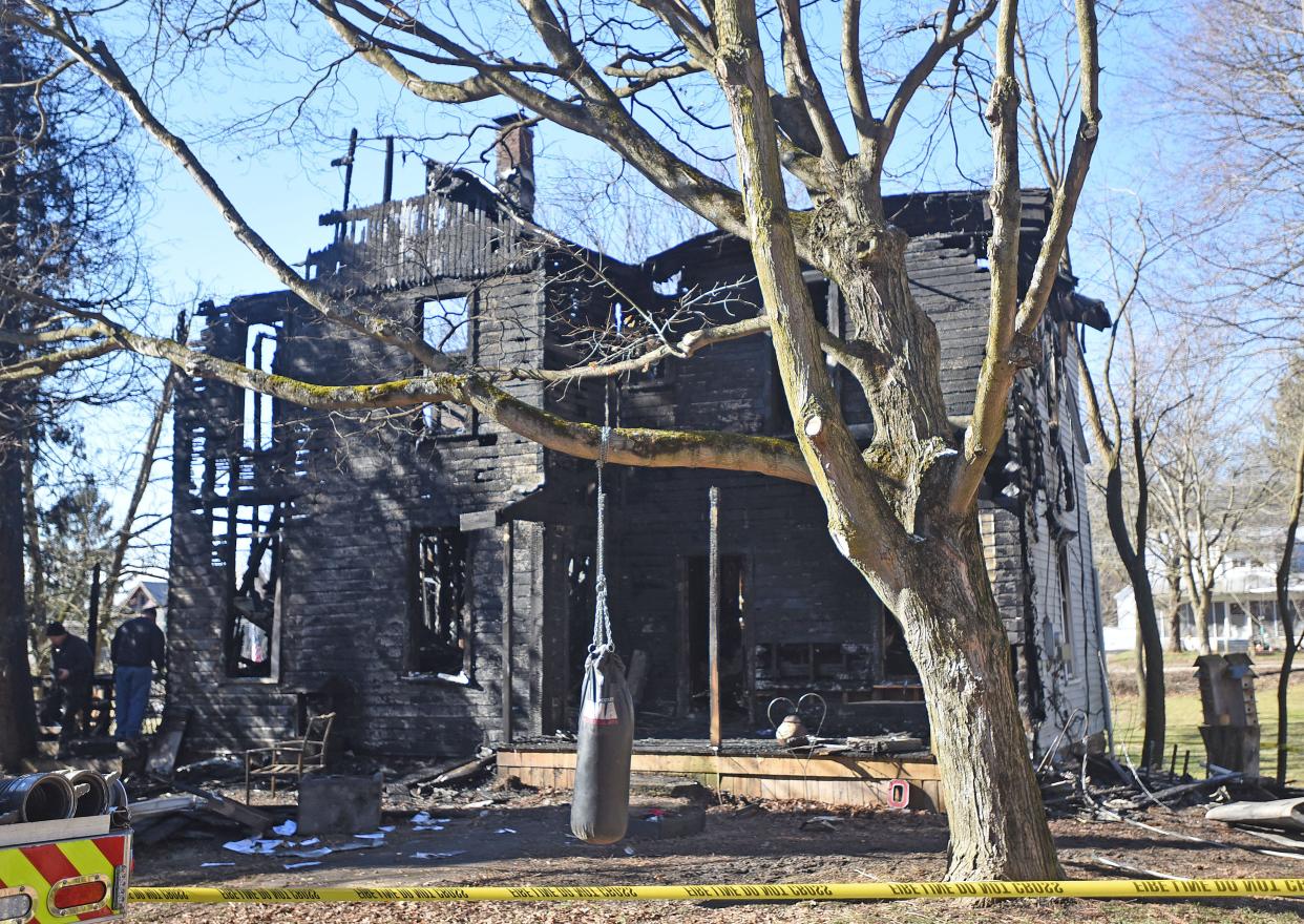 The charred remains stand from a fire at 2445 Oak Street near Pavonia Road in northern Richland County.